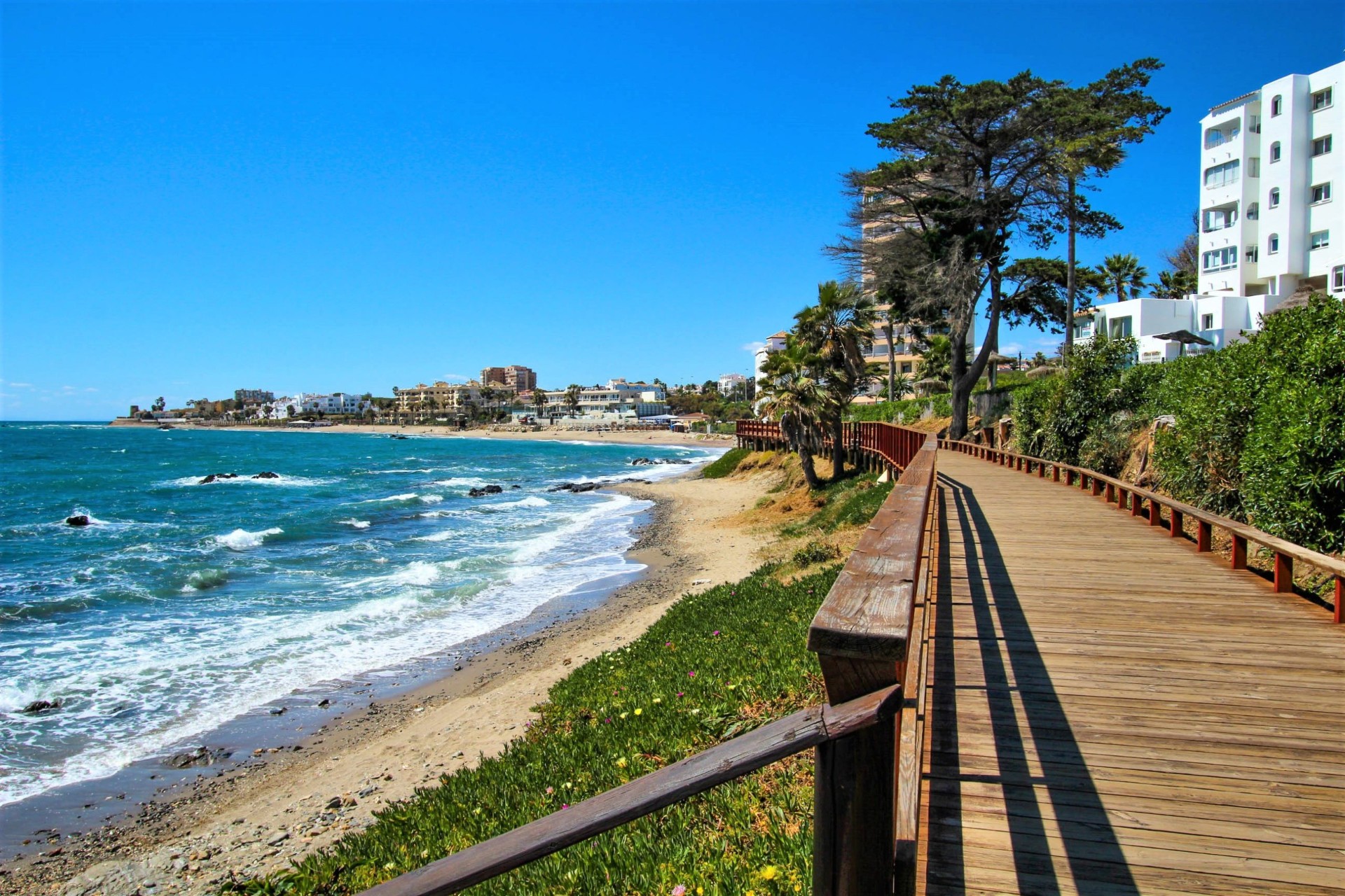 Boardwalk along the Mijas Costa coastline with beach and Mediterranean sea